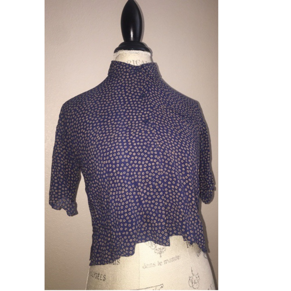 Button up dark blue shirt sleeve shirt w/ flowers.